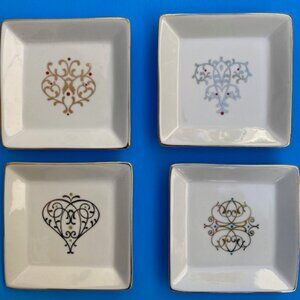 Set of four Noble Excellence Decorative Porcelain Plates with Gold Rims